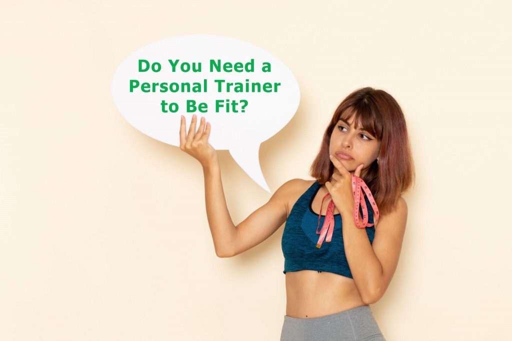 Picture1 Woman in workout gear holds a speech bubble asking, "Do You Need a Personal Trainer to Be Fit?"
