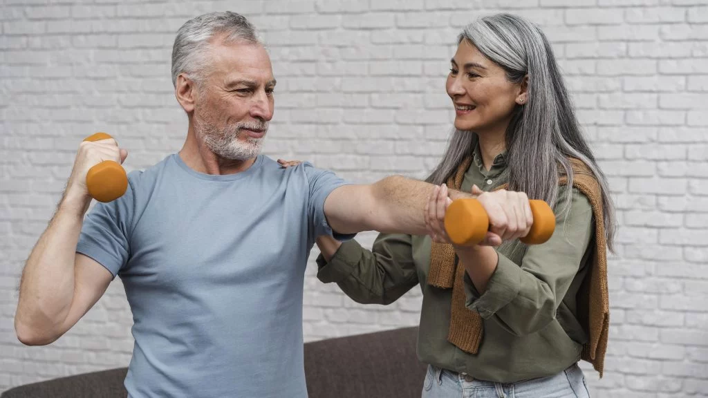 A personal trainer guiding a client through a recovery workout, focusing on strength and form.