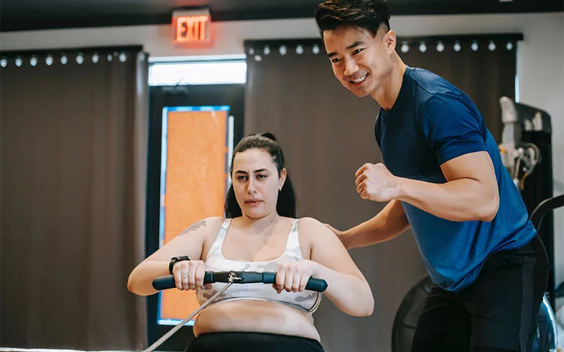 A trainee is trying so hard, and her trainer is encouraging