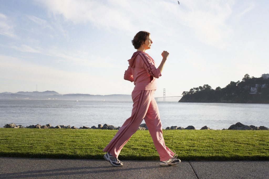 A woman is joggling with ineffective arm motion