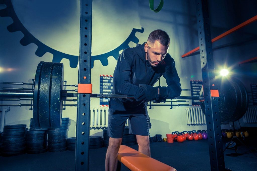 Picture3 Being a fitness coach requires focus and dedication, as shown by this man preparing for strength training.