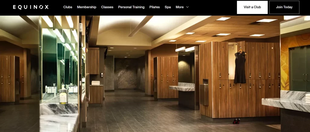 Screenshot of Equinox Los Angeles website showing a luxury locker room with wood finishes and marble counters.