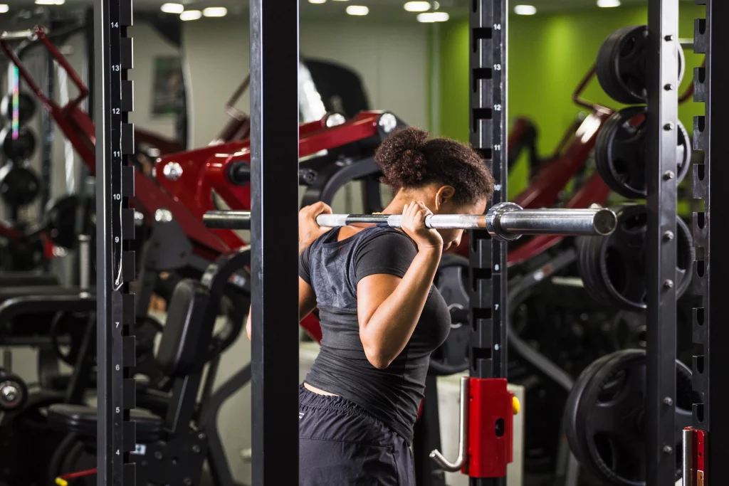 Woman strength training at one of the best gyms in Vancouver